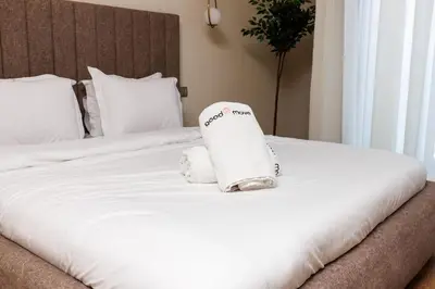 a hotel room with a bed with a towel on it at Stylish 1BR flat in Hay Riad Central Rabat in Rabat