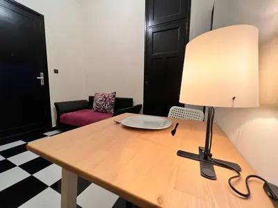 a table with a lamp on top of it at Casablanca Central Suites - Casa Port in Casablanca
