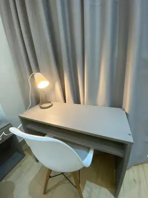 a desk and a chair with a lamp on it at Lovely Studio in the city centre with WIFI. in Casablanca
