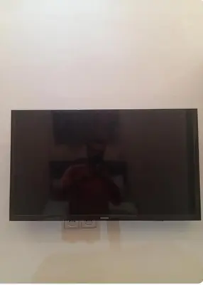 a flat screen tv hanging on a wall at Lovely Studio in the city centre with WIFI. in Casablanca