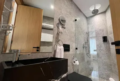 a bathroom with a sink and a shower at Studio chic avec parking in Casablanca