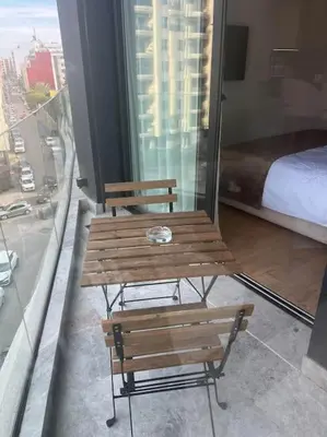 two wooden benches sitting on top of a building at Studio chic avec parking in Casablanca