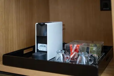 a black tray with a appliance on a table at Studio chic avec parking in Casablanca
