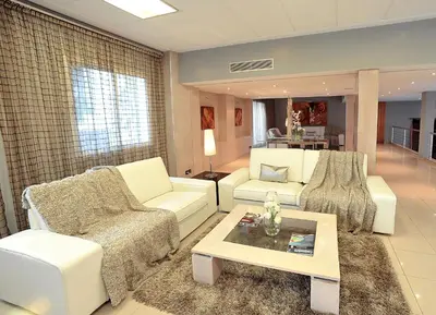 a living room with two couches and a coffee table at Casablanca Suites & Spa in Casablanca