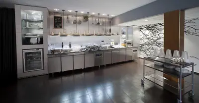 a large kitchen with stainless steel appliances in a room at Casablanca Suites & Spa in Casablanca