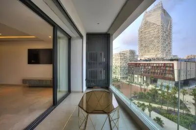 a room with a view of a city from a window at Appart en face de la tour CFC in Casablanca