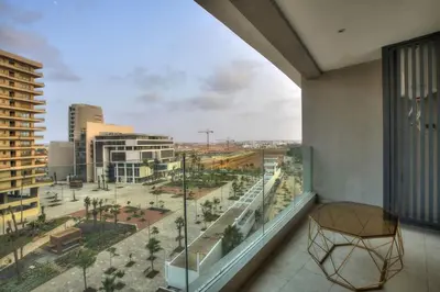 a balcony with a view of a city with buildings at Appart en face de la tour CFC in Casablanca