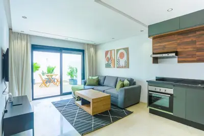 a living room with a couch and a table at Serenity in Casablanca