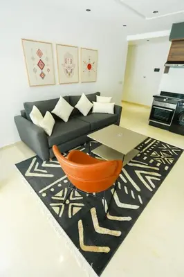 a living room with a couch and a table at Serenity in Casablanca