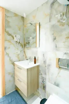 a bathroom with a sink and a shower at Serenity in Casablanca