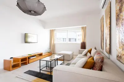 a living room with a couch and a table at Charming apartment, in heart of Agdal, 2 rooms in Rabat