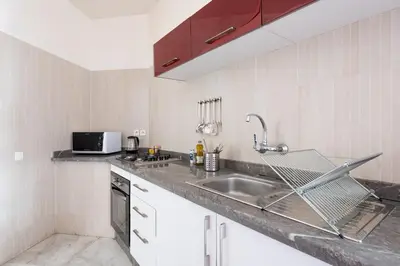 a kitchen with a sink and a microwave at Charming apartment, in heart of Agdal, 2 rooms in Rabat