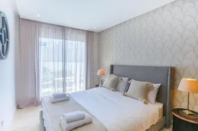 a bedroom with a large bed with towels on it at Waterloo in Casablanca