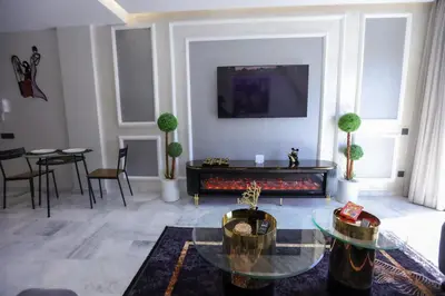 a living room with a couch and a table at Modern Cozy Ghandi District in Casablanca