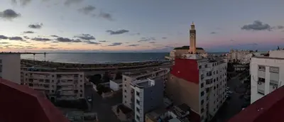 a city with a tower on top of a building at Appartement Panoramique in Casablanca