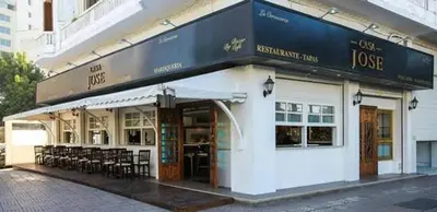 a building with a restaurant with tables and chairs at Appartement Panoramique in Casablanca