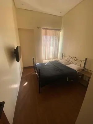 a bedroom with two beds and a window at prestigieuse à casa finance city in Casablanca