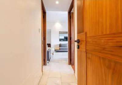 an open door to a hallway with a living room at prestigieuse à casa finance city in Casablanca