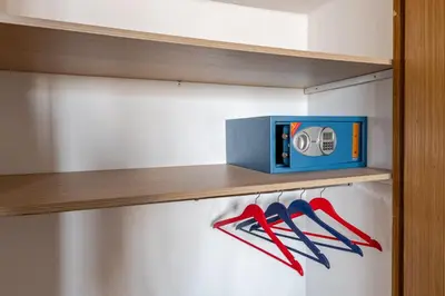a wooden shelf with a blue box and red scissors at New Luxurious apartment Agdal Rabat center in Rabat
