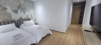 a bedroom with two beds with white sheets at Eden Room SCH in Rabat