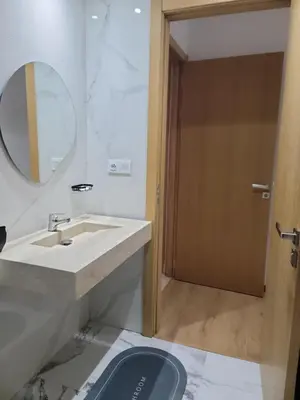 a bathroom with a sink and a mirror at Eden Room SCH in Rabat