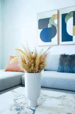 a white vase on a table in a living room at Résidence B Livin - Oasis in Casablanca