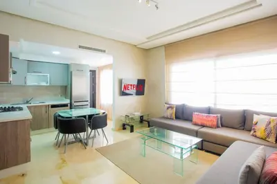 a living room with a couch and a table at Résidence Urban Square F26 in Casablanca