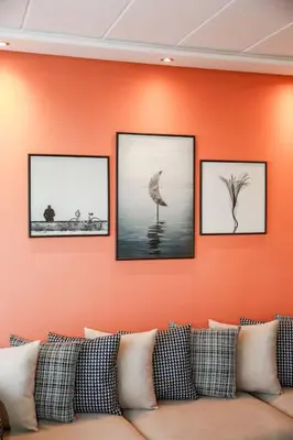 a couch sitting in a room with pictures on the wall at Résidence Smalto - Bd Anfa in Casablanca