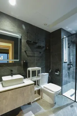 a bathroom with a sink and a toilet and a shower at Résidence Marie Césaire - Maarif in Casablanca