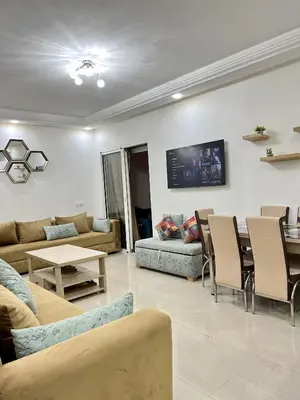 a living room with a couch and a table at Appartement Moderne à OlaBlanca2 in Sidi Rahal