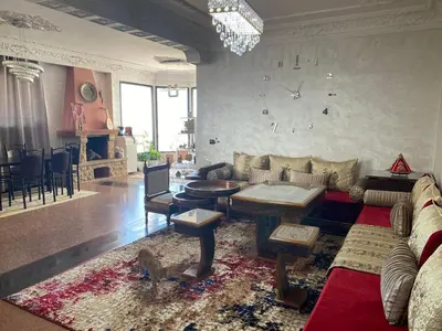 a living room with a couch and a table at اقامة الهام in Casablanca