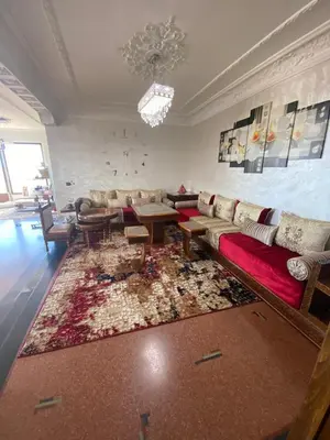 a living room with a couch and a rug at اقامة الهام in Casablanca