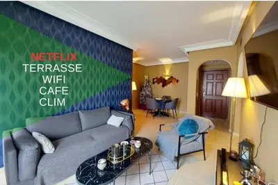 a living room with a couch and a table at Appartement chic avec Terrasse in Casablanca