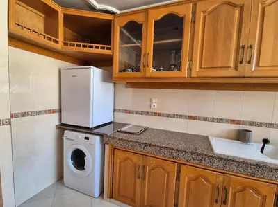 a kitchen with a washing machine and a washer at My Cosy Place Rabat - Cosy Apartement Avenue de France in Rabat