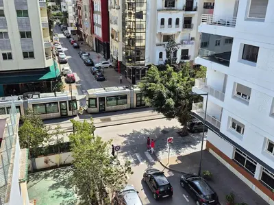 an aerial view of a city street with a tram at My Cosy Place Rabat - Cosy Apartement Avenue de France in Rabat