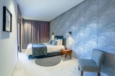 a bedroom with a bed and a blue wall at #23 New Charming Casablanca Retreat/keyless door in Casablanca