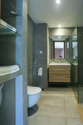 a bathroom with a tub and a toilet and a sink at #23 New Charming Casablanca Retreat/keyless door in Casablanca