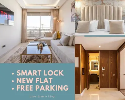 a living room with a new apartment with a bed and a couch at Keyless Smart door/ New /Free parking/Central in Casablanca