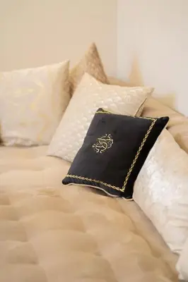 a pillow sitting on top of a bed with pillows at Keyless Smart door/ New /Free parking/Central in Casablanca