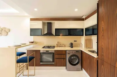 a kitchen with a washer and a dishwasher at Keyless Smart door/ New /Free parking/Central in Casablanca