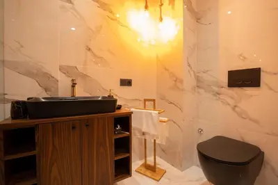 a bathroom with a sink and a toilet at Keyless Smart door/ New /Free parking/Central in Casablanca