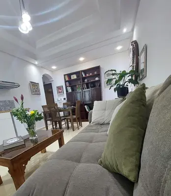 a living room with a couch and a table at Chabili Appartements in Temara