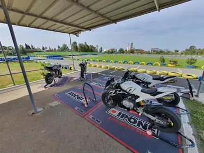 two motorcycles on display at a race track at Best appartement pools view at Mansouria in Mohammedia