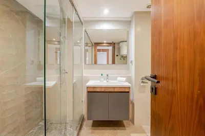 a bathroom with a sink and a shower with a mirror at 1 Bedroom with Terrace Casablanca City Center in Casablanca