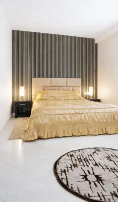 a bedroom with a large bed with two lamps at Cozy appartement à Mohammedia in Mohammedia