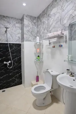 a bathroom with a toilet and a sink at Cozy appartement à Mohammedia in Mohammedia