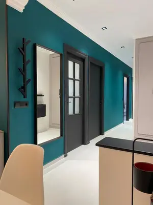 a dining room with blue walls and a counter at RABAT RESIDENCE - Apartments in Rabat