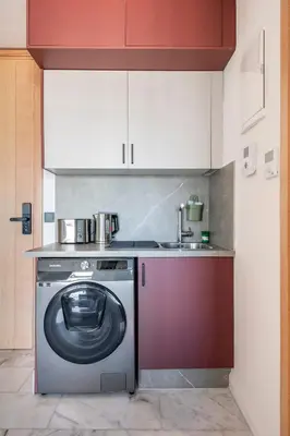a kitchen with a washing machine and a sink at Tribeca 3 - Casablanca Center in Casablanca