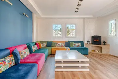 a living room with a couch and a coffee table at 4 min à pied de la Plage, 3 BR, Piscine, Parking in Skhirat