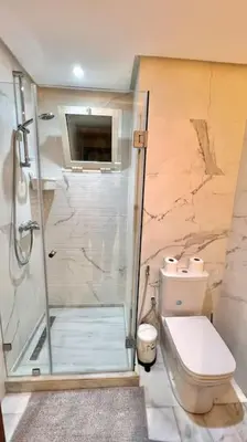 a bathroom with a shower and a toilet at N9 Appartement pied sur mer, La Corniche Rabat in Rabat